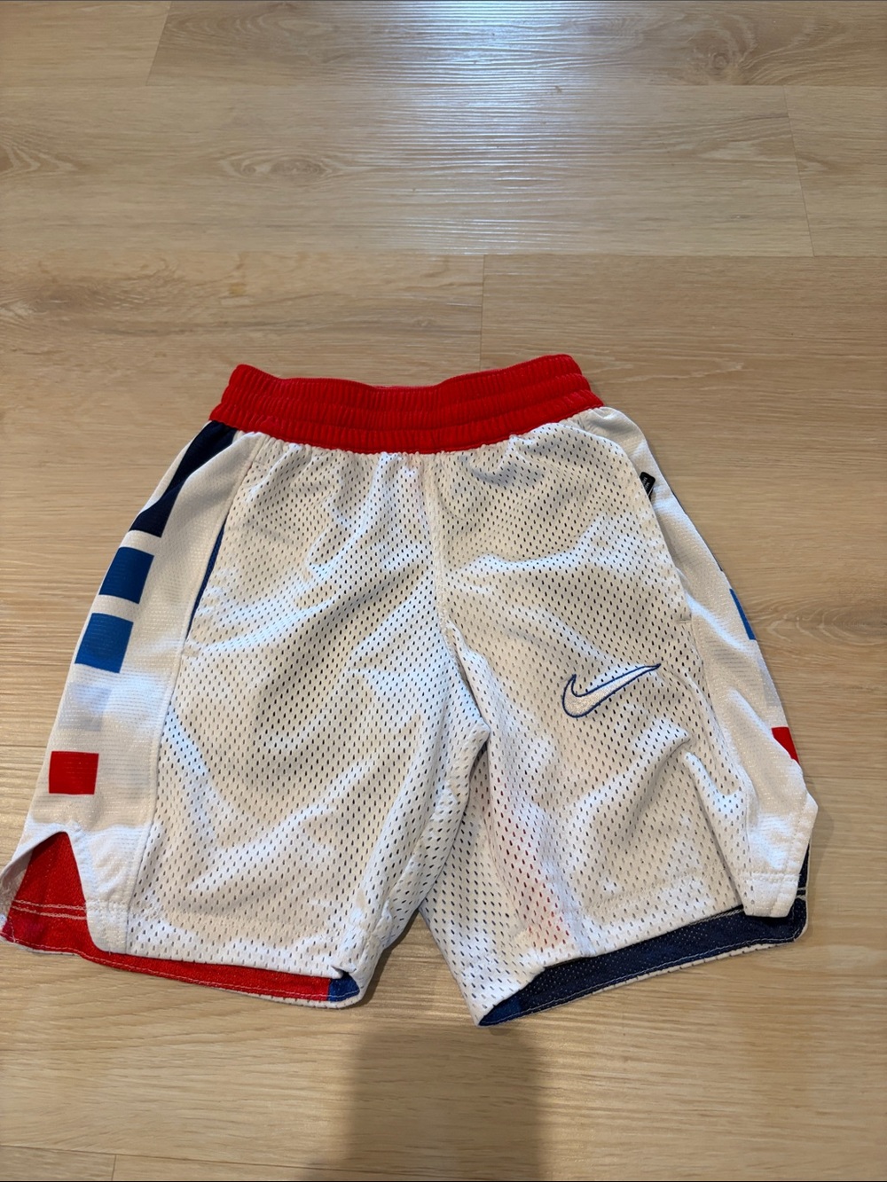 Nike White Mesh Shorts with Red Waistband and Blue Accents